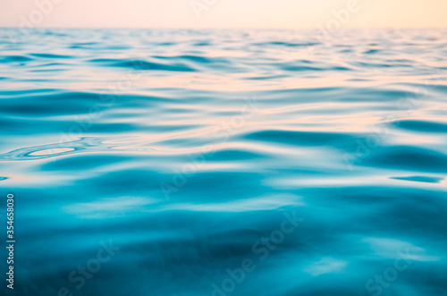 Seascape background colorful sea waves at sunset