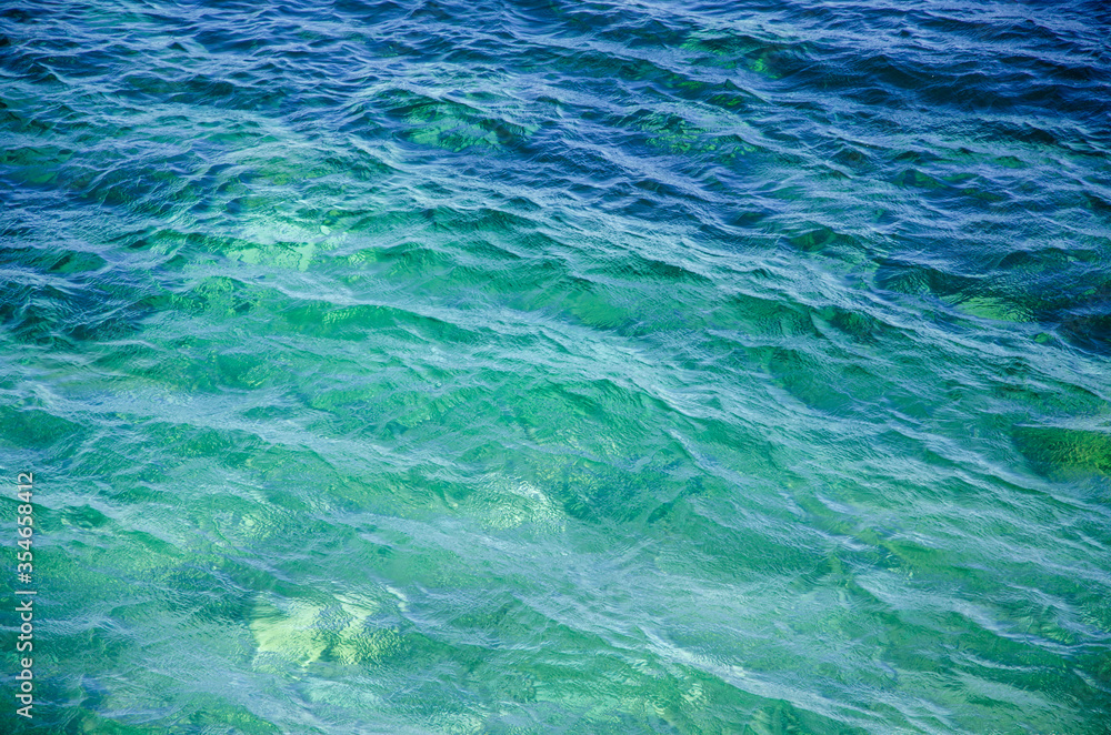 Fototapeta premium Vivid turquoise seascape background colorful surface of water