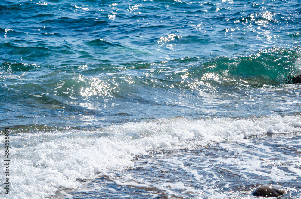 Seascape background white waves on blue sea Seascape background white waves on blue sea