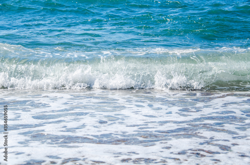 Seascape background white waves on blue sea Seascape background white waves on blue sea