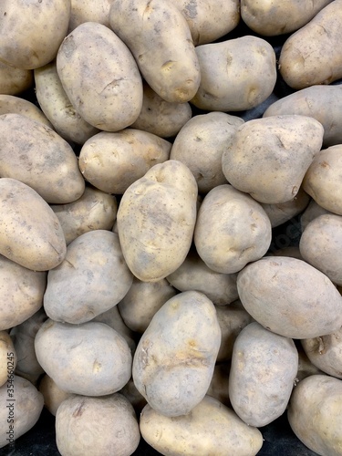 Group of potatoes in market. Potato background.