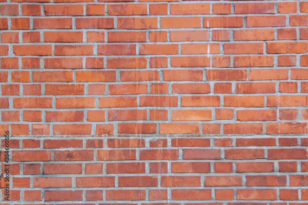 Old red brick wall. Bricks with individual texture with concrete layering . Old red brick wall. Bricks with individual texture with concrete layering .