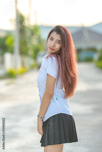 Portrait of asian or thai student university uniform beautiful girl relax and smile © background photo