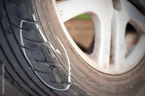 Tear marks on bald tires, car use unsafe tyre dangerous for vehicle.