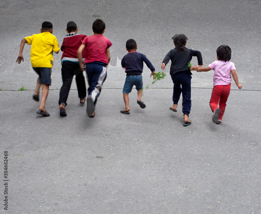 A blurry photo of children running away into the distance. A blurry photo of children running away into the distance.
