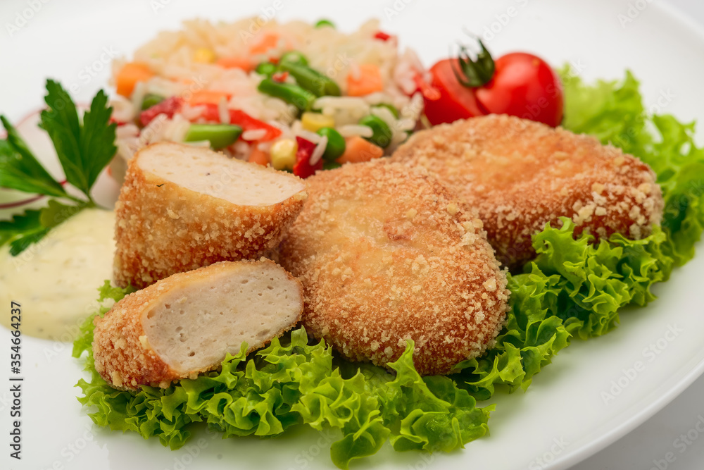 Chicken cutlets in batter with risotto and vegetables Chicken cutlets in batter with risotto and vegetables