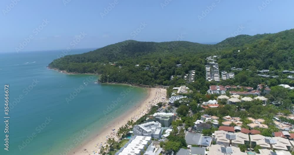 An aerial view shows tourists enjoying the beach at the Shire of Noosa in Queensland, Australia. An aerial view shows tourists enjoying the beach at the Shire of Noosa in Queensland, Australia.
