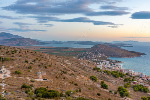 Ragged coastline of Sarande viewed behind a lighthouse, Albania photo