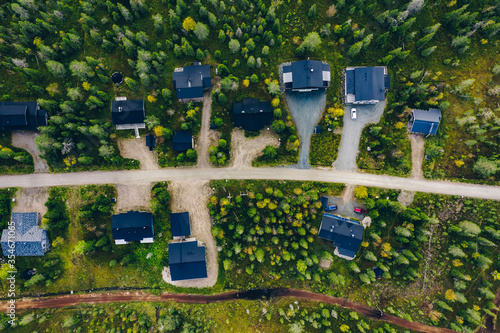 Εκτύπωση καμβά Aerial view of rural village, residential area with cottages in Finland