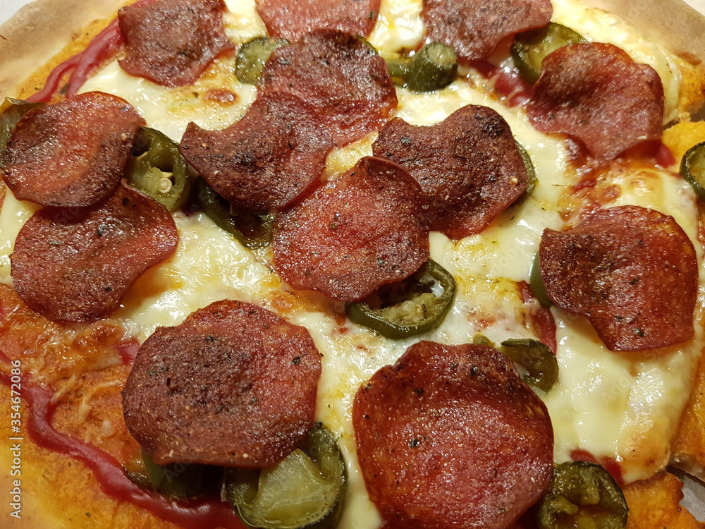 pepperoni pizza with green jalapeno pepperoni pizza with green jalapeno