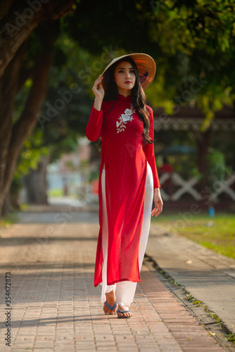 Portrait of Vietnamese girl traditional red dress,Beautiful young asian woman wearing Vietnam