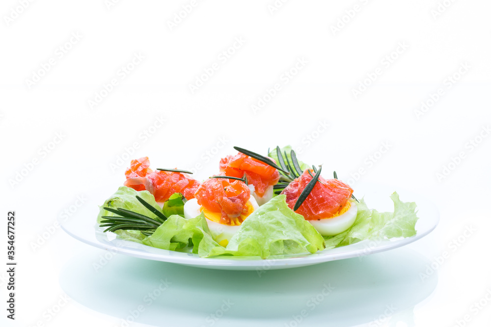 boiled eggs with salted red fish and salad leaves boiled eggs with salted red fish and salad leaves