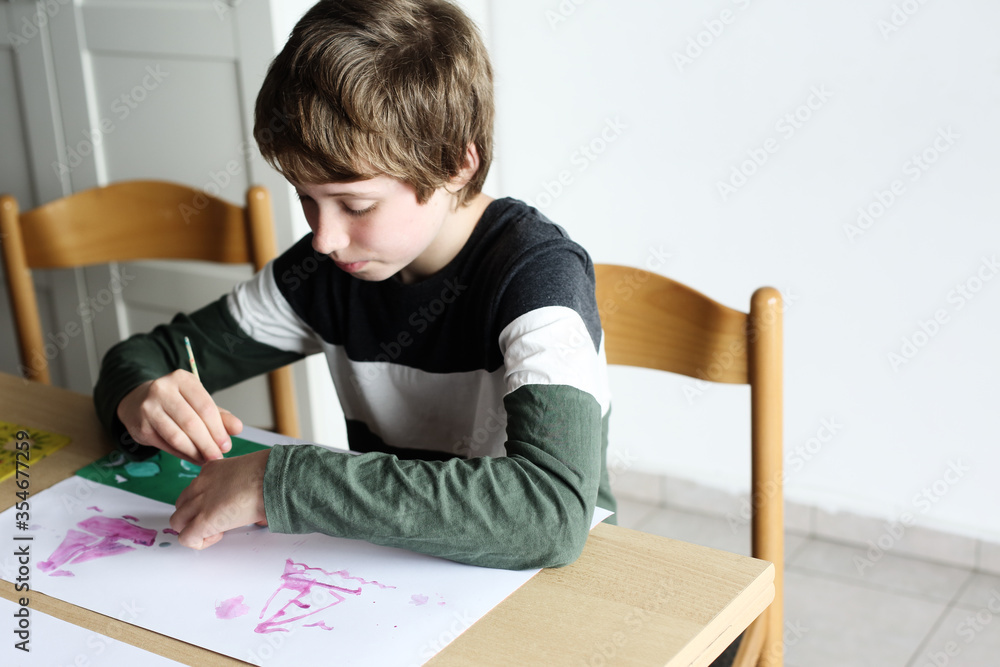 Cute 12 years old autistic boy drawing Cute 12 years old autistic boy drawing