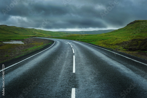 The black road heading straight ahead. © Andrii Vergeles