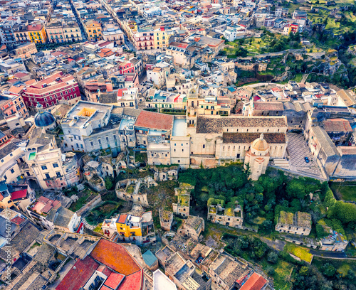 Straight-down view from flying drone. Aerial morning cityscape of Gravina in Puglia tovn. Picturesque summer landscape of Apulia, Italy, Europe. Traveling concept background.
