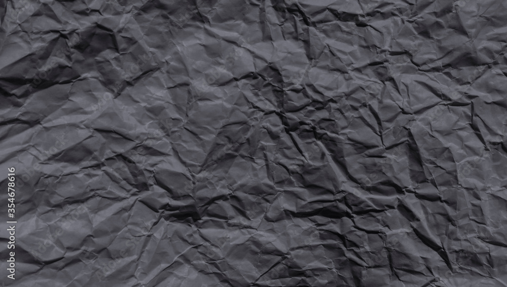 Sheet of black crumpled paper useful as a background. Sheet of black crumpled paper useful as a background.