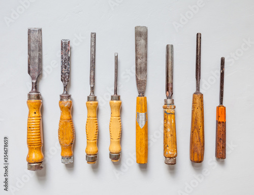 Wallpaper Mural High quality old chisel / chisel set Chisel set chisel background home improvement cherry wood handicraft carpentry tradition antique wood craft expertise risk of injury training training cours Torontodigital.ca