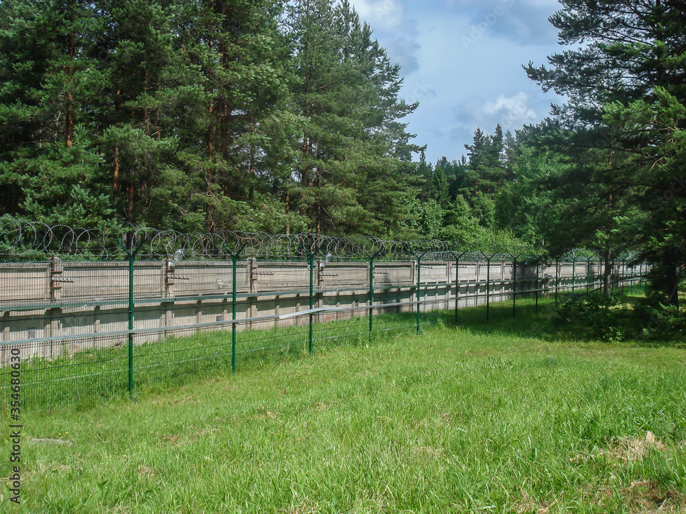 Fence with barbed wire defending