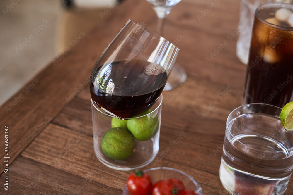 glasses on a wooden table with cherry iced coffee glasses on a wooden table with cherry iced coffee