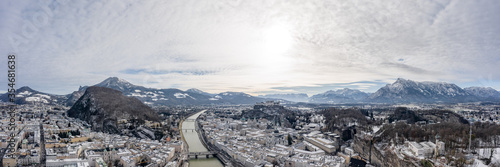 Panoramic aerial drone shot view of snoy Salzburg in winter morning