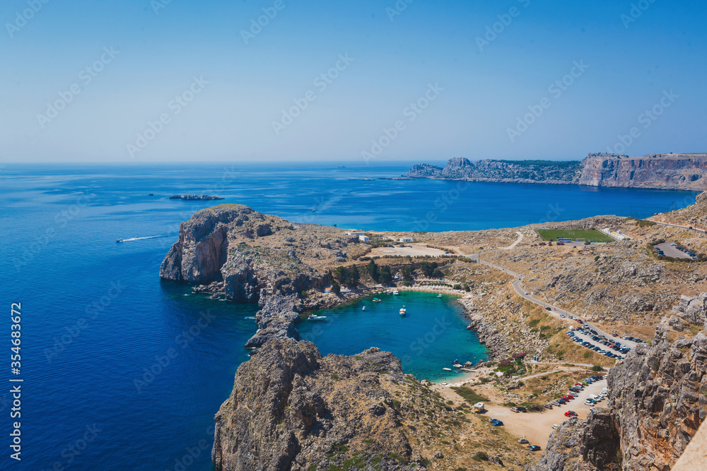 Fototapeta premium Overlooking the blue Aegean Sea from the Acropolis, Lindos, Greece