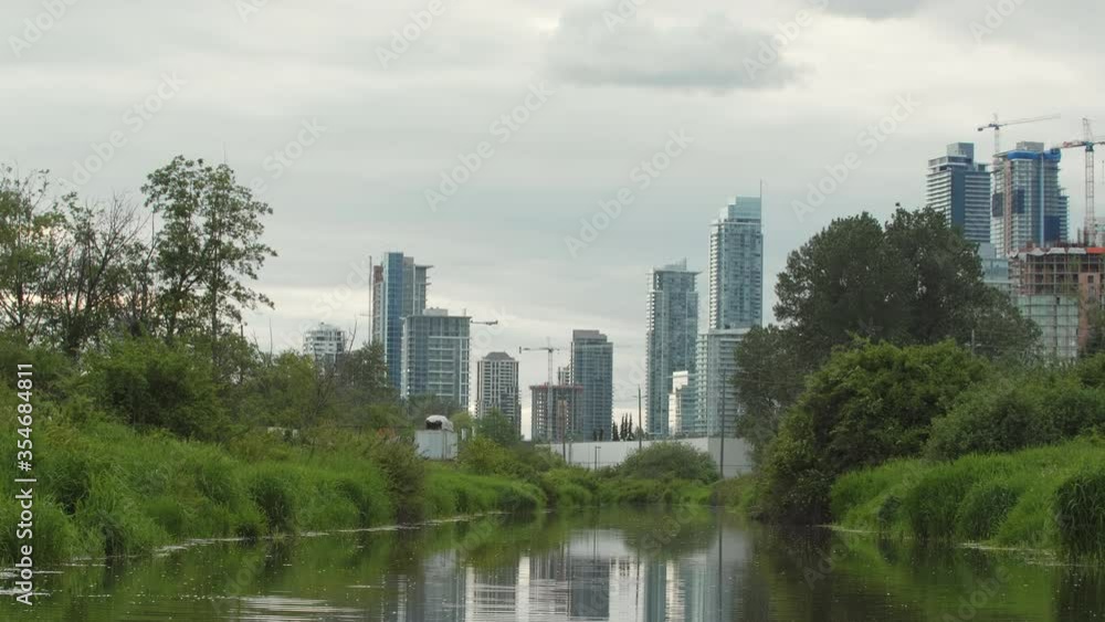 Burnaby towers and cranes, Unique perspective from the water in the spring Burnaby towers and cranes, Unique perspective from the water in the spring