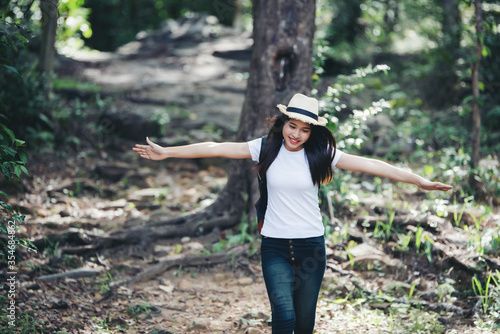 Lifestyle beautiful woman happy torist to travel in wild trip hiking during vacation.Travel Concept. photo