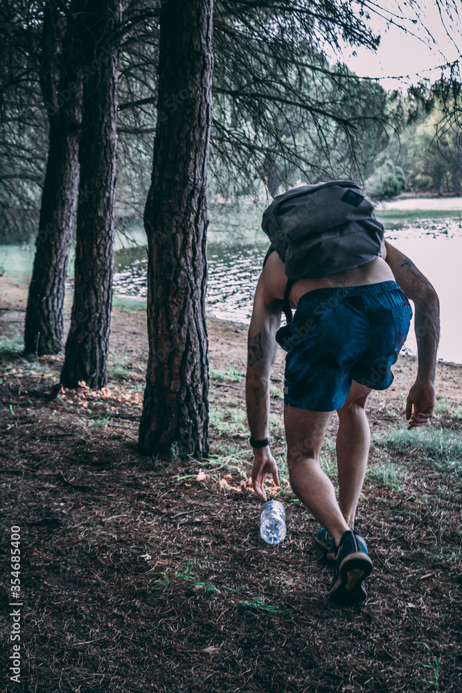 Sportsman picking up trash, the sport is better known as Plogging. Sportsman picking up trash, the sport is better known as Plogging.