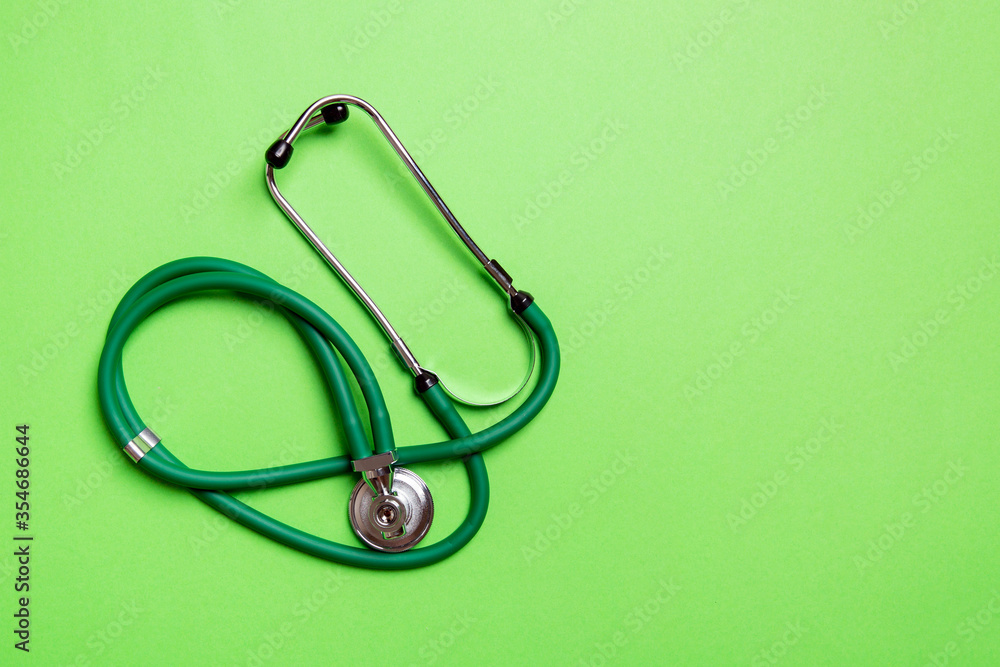 Top view of green stethoscope on colorful background. Medical diagnosis ...