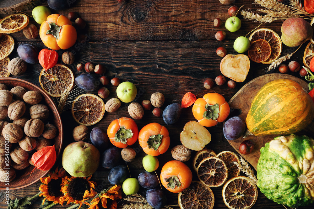 Autumn still-life composition with fresh fruits and vegetables on rustic wooden table Autumn still-life composition with fresh fruits and vegetables on rustic wooden table
