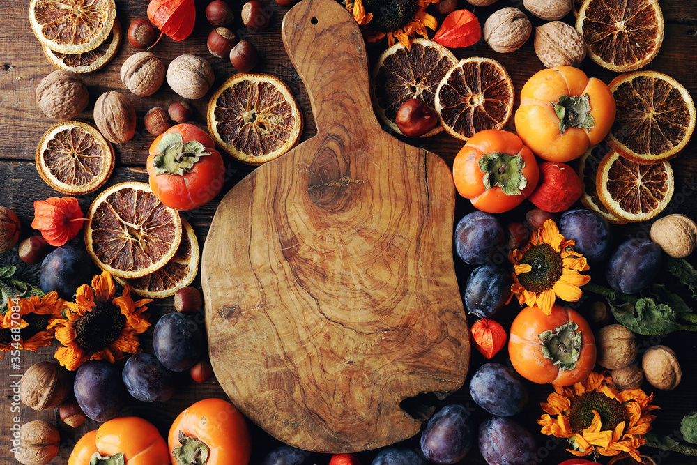 Autumn still-life composition with fresh fruits and vegetables on rustic wooden table Autumn still-life composition with fresh fruits and vegetables on rustic wooden table
