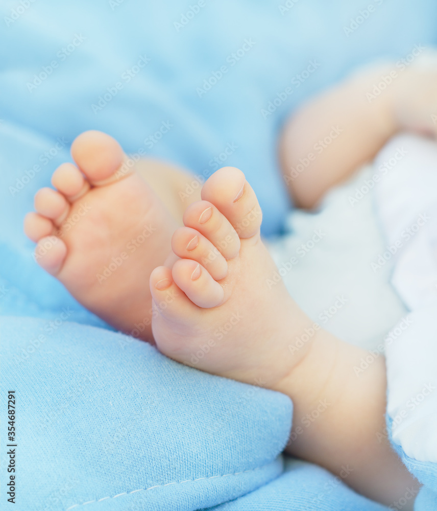 Close-up Newborn baby's feet on blanket Close-up Newborn baby's feet on blanket