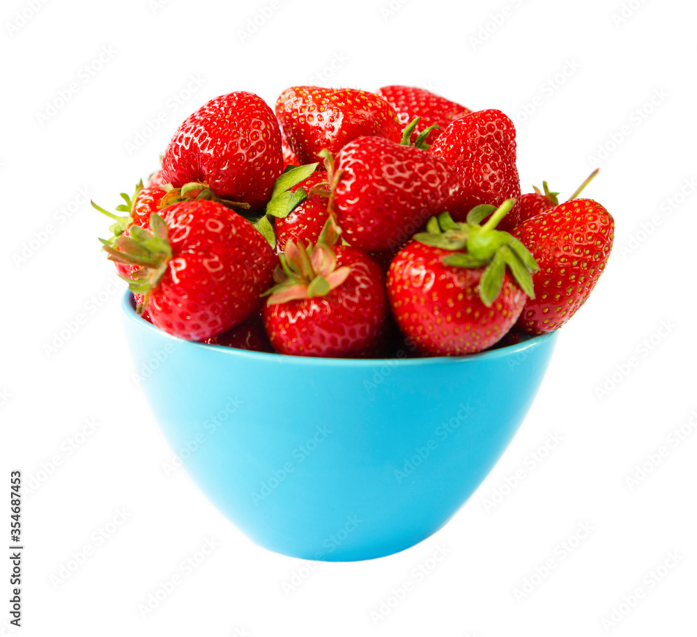 fresh strawberries in a blue cup on a white background fresh strawberries in a blue cup on a white background