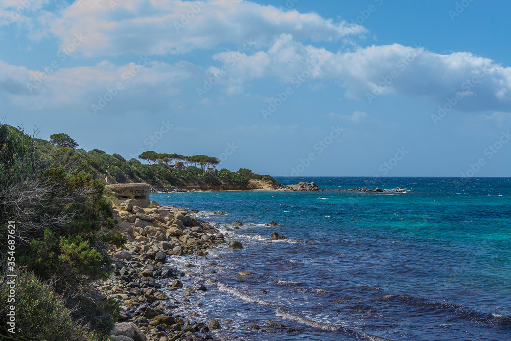 Rocky coast with ruined military blockhouse near Cagliari (Sardinia, Italy).