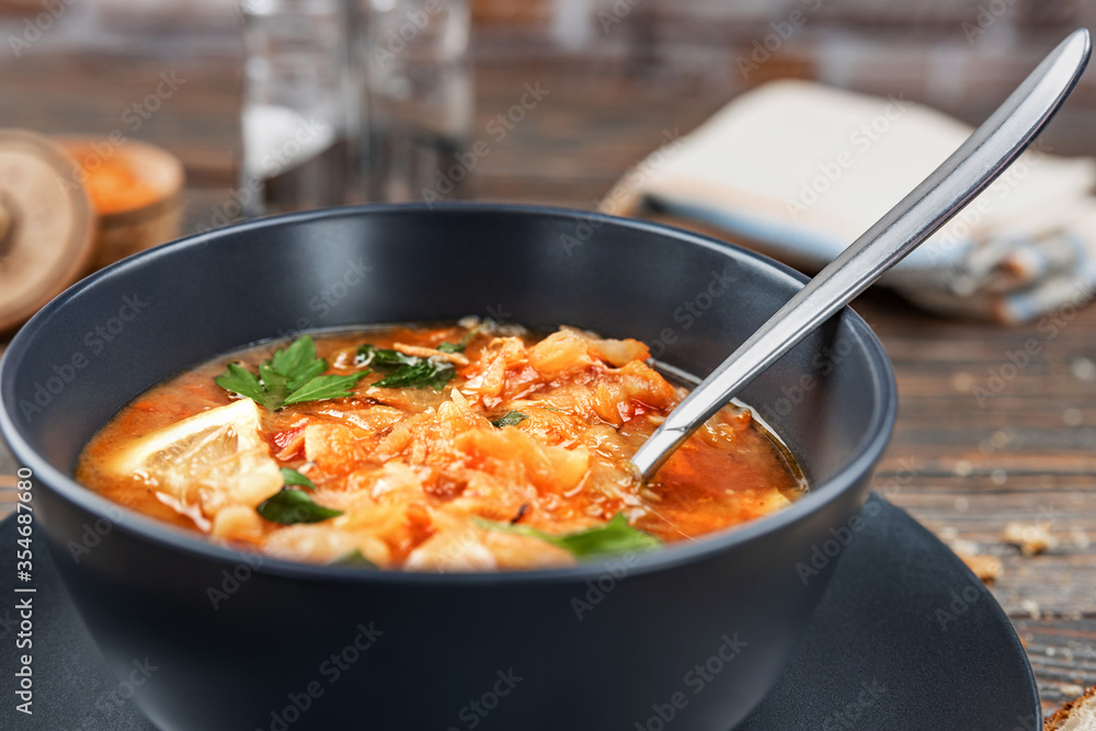 Red soup with vegetables and meat, tasty, traditional Ukrainian borsch, close-up, shallow depth of field, selective focus. Healthy Organic Homemade Food Concept