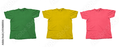 green, yellow and pink t shirts isolated on a white background , banner with blank clothes mock up
