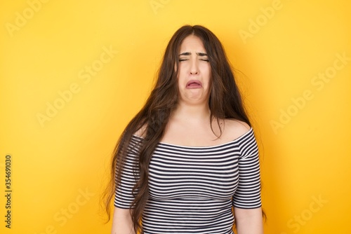 Negative human expressions and attitude. Angry dissatisfied female has disgusting expression as sees something not appealing, frowns face, isolated over white background. Distaste and dislike