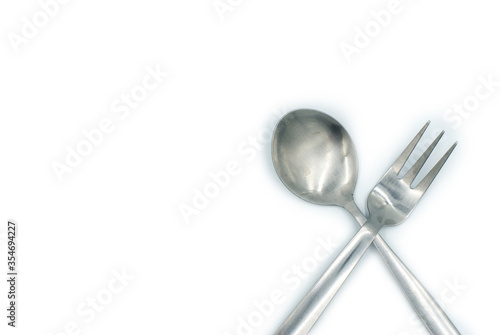 Spoons and forks on a white background