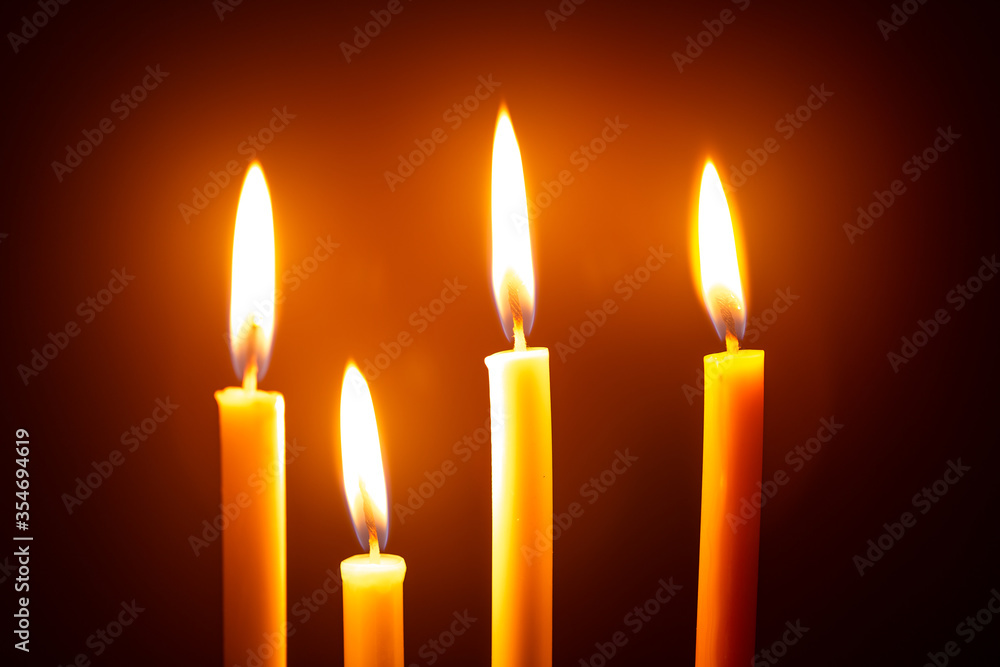 Black background with many burning candles, vector illustration Black background with many burning candles, vector illustration