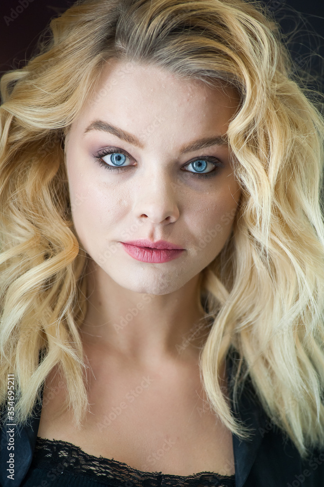 Pretty blonde with blue eyes and wavy hair Pretty blonde with blue eyes and wavy hair