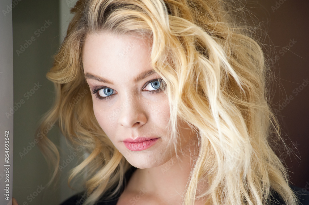 Pretty blonde with blue eyes and wavy hair Pretty blonde with blue eyes and wavy hair