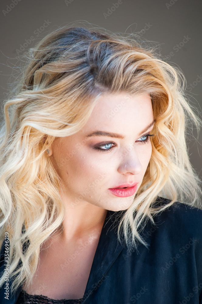 Pretty blonde with blue eyes and wavy hair