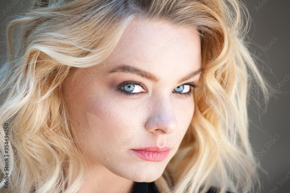 Pretty blonde with blue eyes and wavy hair Pretty blonde with blue eyes and wavy hair