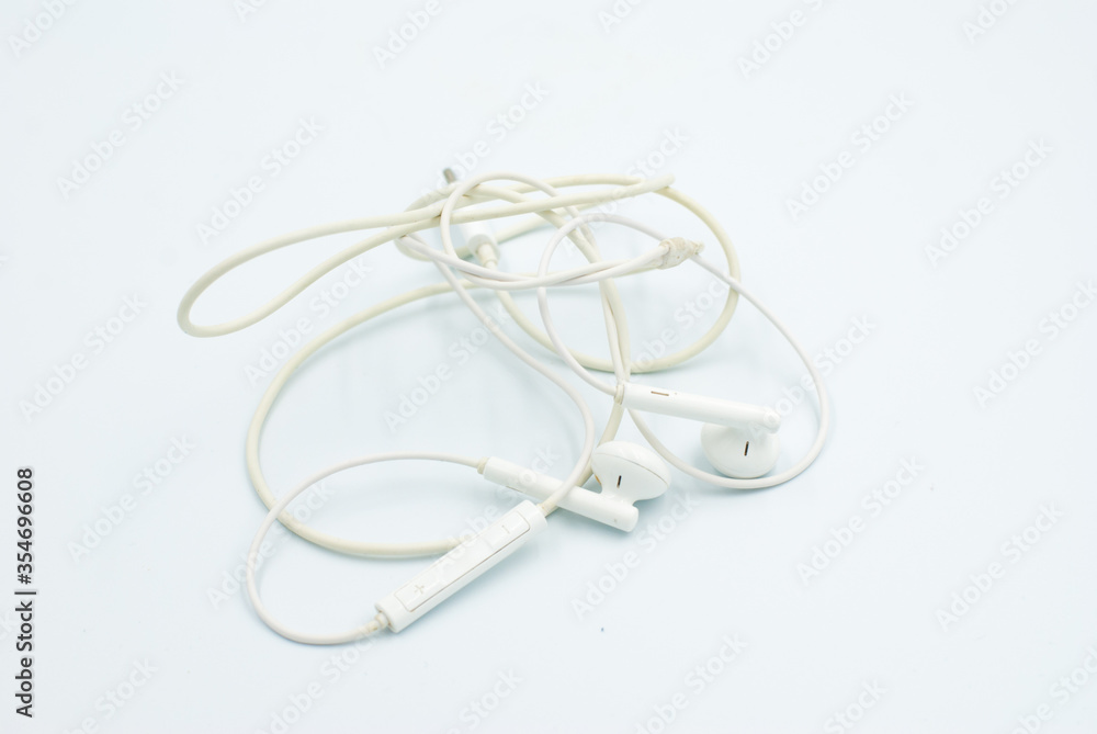 Headphone cable tangled on a white background Headphone cable tangled on a white background