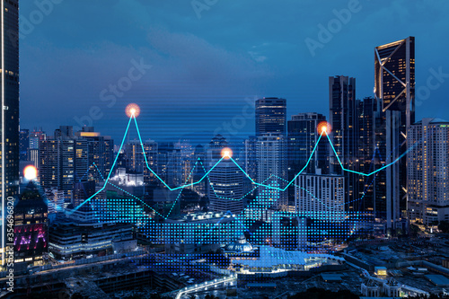 Photography Stock market graph hologram, night panorama city view of Kuala Lumpur