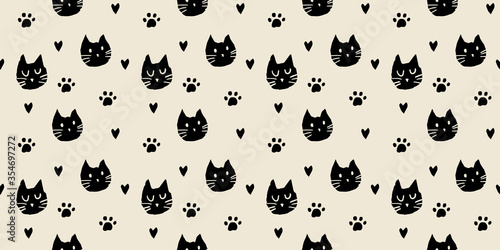 Hand drawn black and white cat paw heart icon seamless background for textile wallpaper fabric design. Ink drawing cute texture.