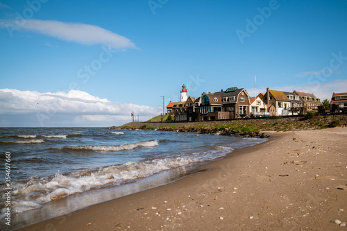 Urk Nehterlands, small fishing village Urk with is colorful lighthouse by the lake Ijsselmeer Netherlands Flevoland photo