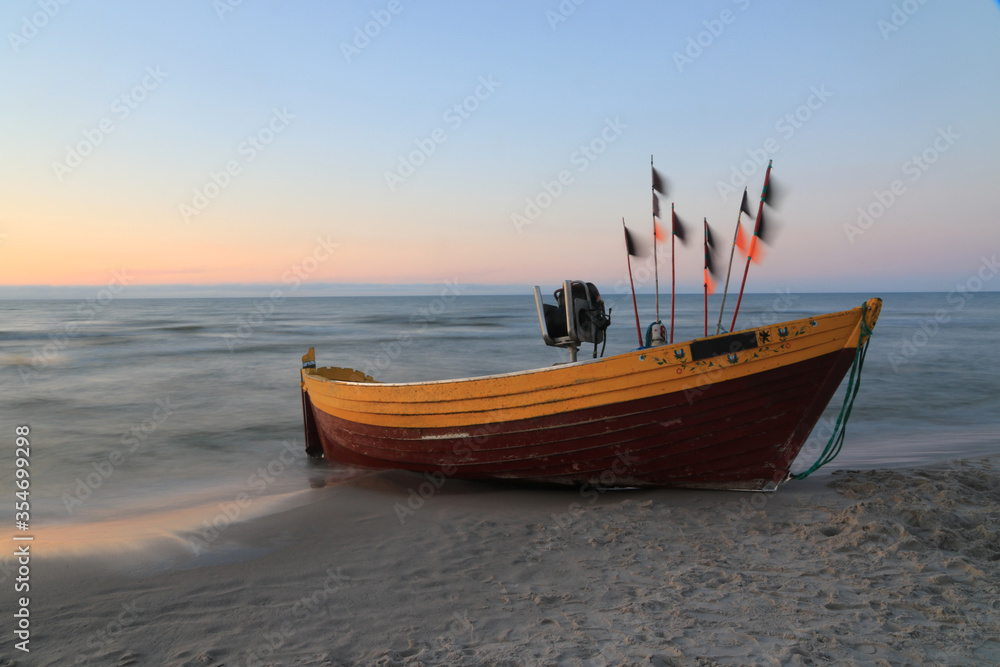 Traditional wooden fishing boats on the beach in Debki, Baltic sea, Poland Traditional wooden fishing boats on the beach in Debki, Baltic sea, Poland