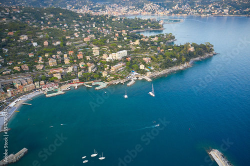 A view above on a seashore of Santa Margherita Ligure, Italy. White boats and yachts on foreground.