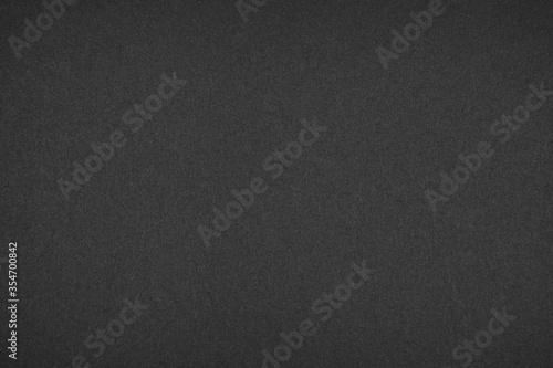 black paper texture or background.